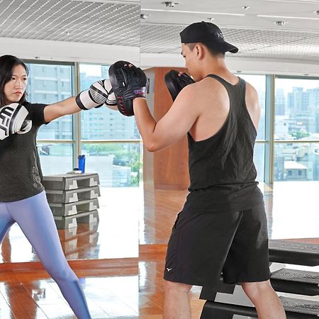 Windsor Hotel Taichung Exteriör bild A woman and a man training in a gym